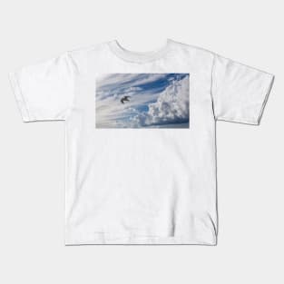 White seagull flying in bright blue sky Kids T-Shirt